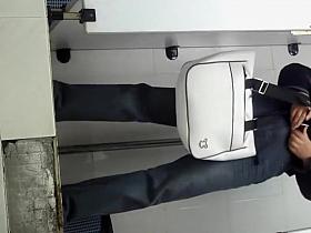 Chinese milf spied taking a piss