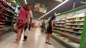 Peeping under a short jeans skirt