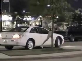 Skinny exhibitionist undresses in a fast food parking lot