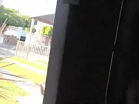 Guy strokes his penis behind door