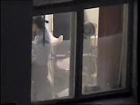 Medical examination voyeured on cam through the window