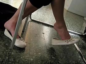 Candid College Teen Shoeplay Dangling Feet in Library