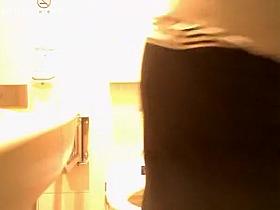 Asian woman caught in public toilet peeing