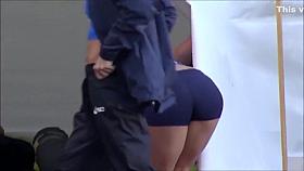 Hot blonde pole vaulter competes at a packed stadium