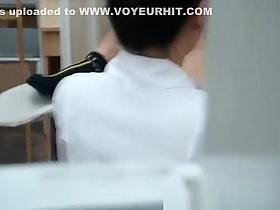 Woman with legs spread in gynecologist chair