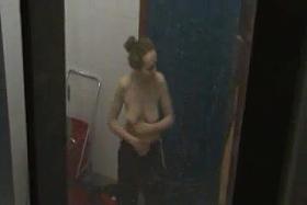 Sporty girls changing and showering in locker room