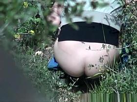 Nice ass woman caught pissing in the woods
