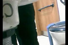 Amateurs without pants sitting on the bowl on hidden camera