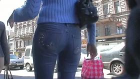 Candid street voyeur enjoys filming tight booties.