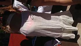 Watch thru white suit showing pink belt