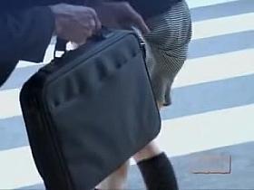 Pro skirt sharking with sticky briefcase on the crosswalk