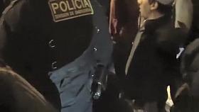 Cops walk a nearly naked criminal down the street