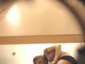 Camera in girls dressing room demonstrates an Asian trying on some sexy lingerie