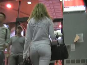 Remarkable street candid of a pretty woman in white suit