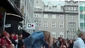 Drunk woman pissing on a bar terrace