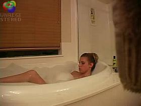 Sexy blond girl caught playing with herself in the bath