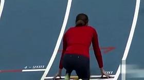 Athletic woman runs around the track in a flimsy outfit