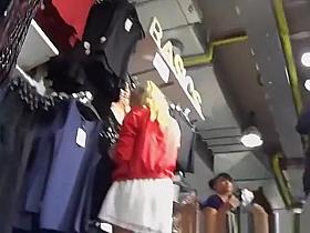 Sexy blonde in white mini skirt upskirt