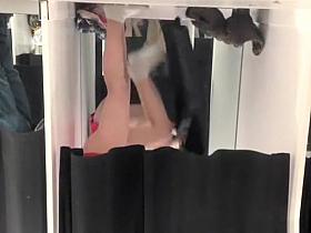 Girl in pink panties trying new clothes