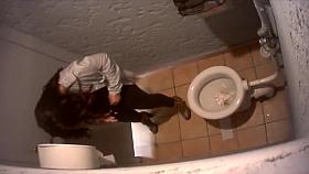 Charming brunette coed gets filmed while taking a whiz