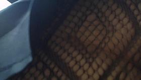 Upskirt of pretty young tart in fishnet tights