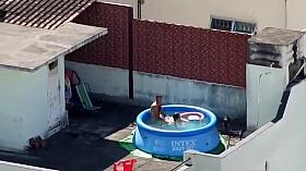 Doggystyle screwing outdoors in the pool
