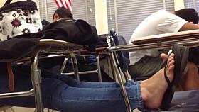 Candid feet flip flops on chair