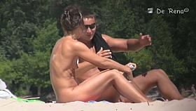 Nude beach voyeur scenes with small titted girl topless