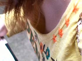 Chubby redhead Japanese shows her cleavage on candid cam video