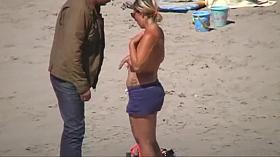 German milf on french beach spy. Shaky quality.