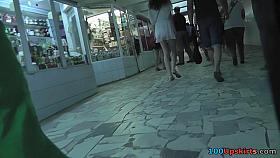 Hot upskirt g-string footage of brunette's flabby ass