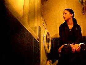 Hot and brunette taking a piss in her bathroom