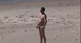 A Voyeur films a pair on beach