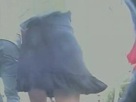 Camera man captures some babes upskirt