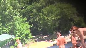 Nude Tanya playing frisbee on the beach