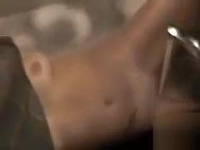 Sister lets the water from the faucet hit her clitoris