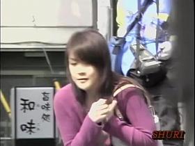 Young Japanese babe has her tits unveiled by a street shark