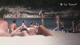 Nudist girl is lying showing the stretched slit to public