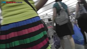 Young peach presents skinny ass in upskirt in public