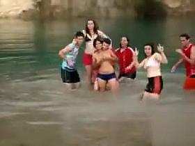 Friends swim in the lake in their underwear