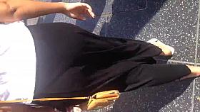 Sexy Latin in dress showing thong