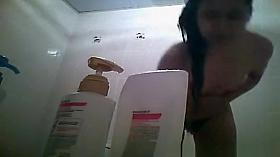 Hairy bush and small tits woman showering