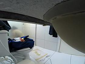 Woman takes off her clothes in bathroom