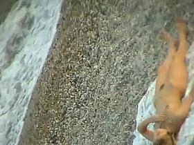 Some teen and mature couples resting at the nudist beach