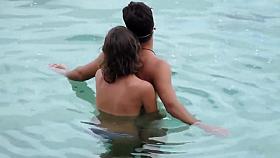 Topless GF captured when giving handjob in the water