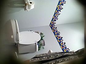 Dreamy girl spied while pissing on a toilet