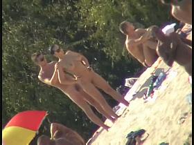 Nude spy cam on the beach with a black hair goddess in focus