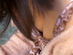 Cute asian babe with nice figure is filmed in a downblouse show