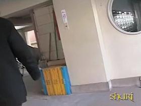 Asian babe unlocking her bike gets a skirt sharking.