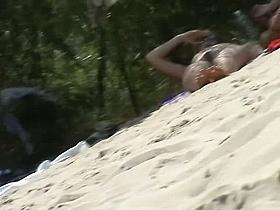 Tempting pussy and ass shots by a nude beach voyeur